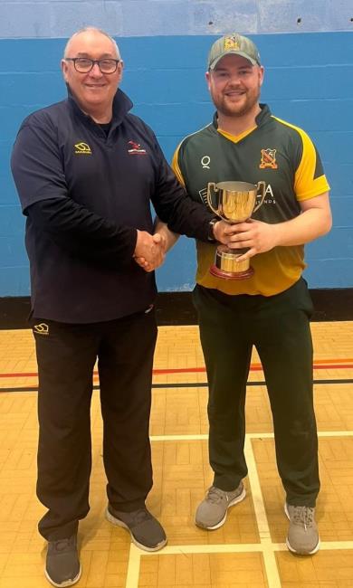  Sion Evans presents the cup to Adam Davies